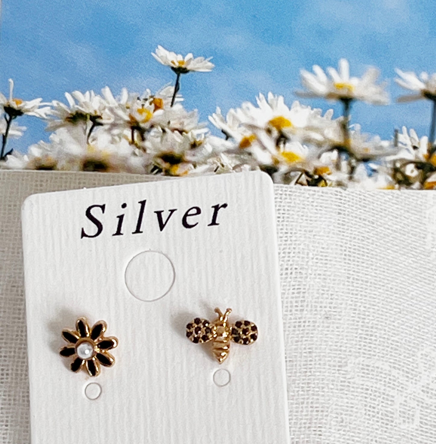 Black cubic setting tiny honey bee and daisy flower earrings