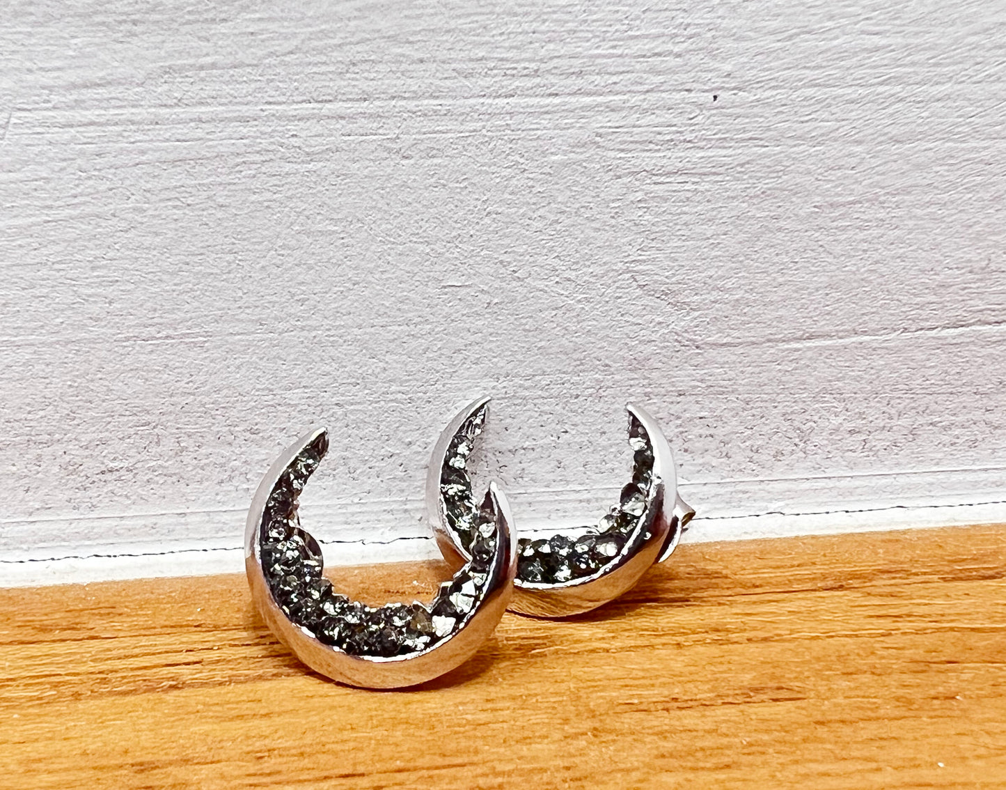 Crescent moon druzy stud earrings detailed with Black Diamond Crystals