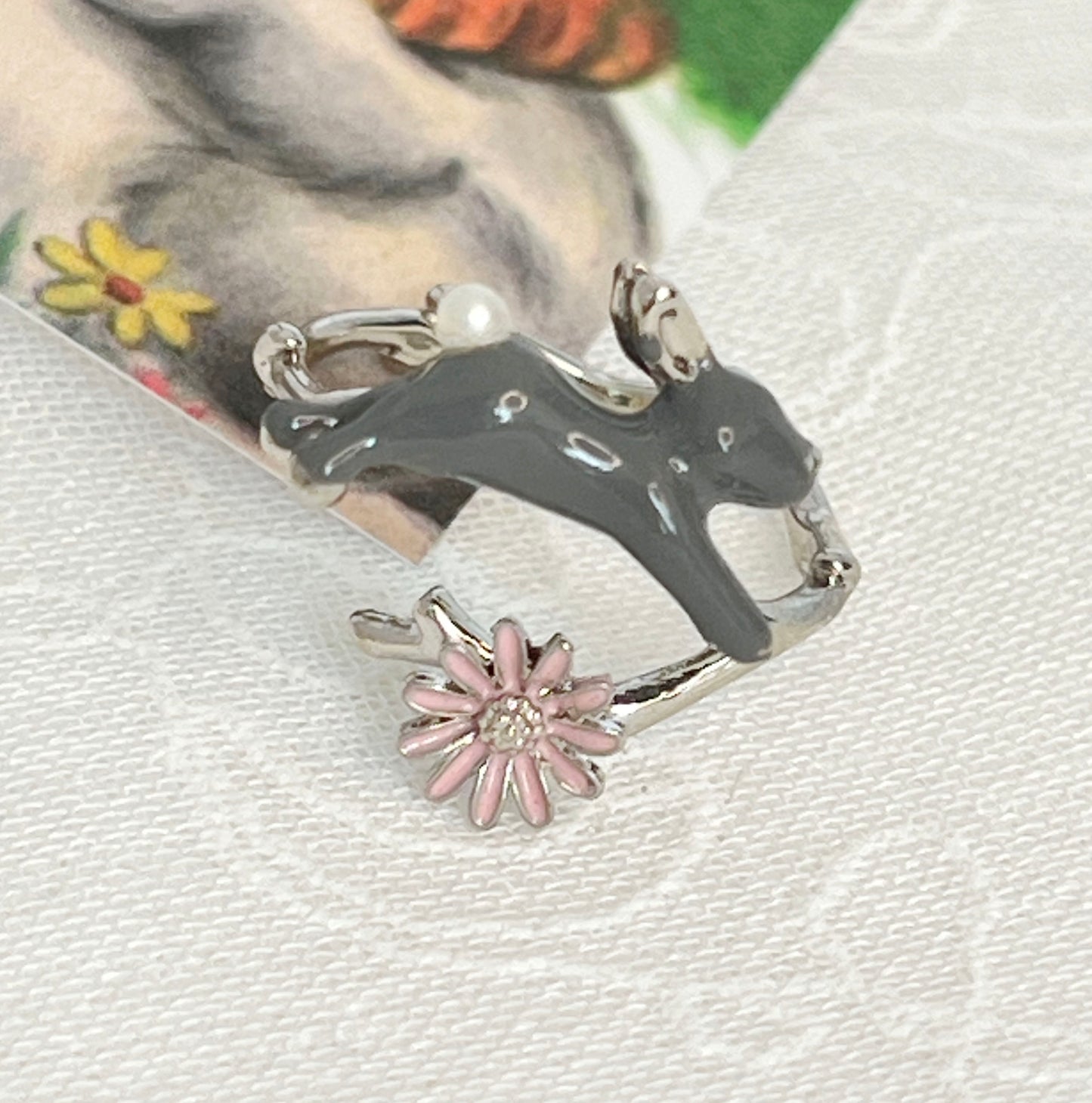 Cute hopping rabbit jumps above flower and branch Wrap adjustable Ring in 2 colors