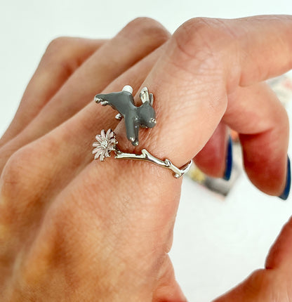 Cute hopping rabbit jumps above flower and branch Wrap adjustable Ring in 2 colors