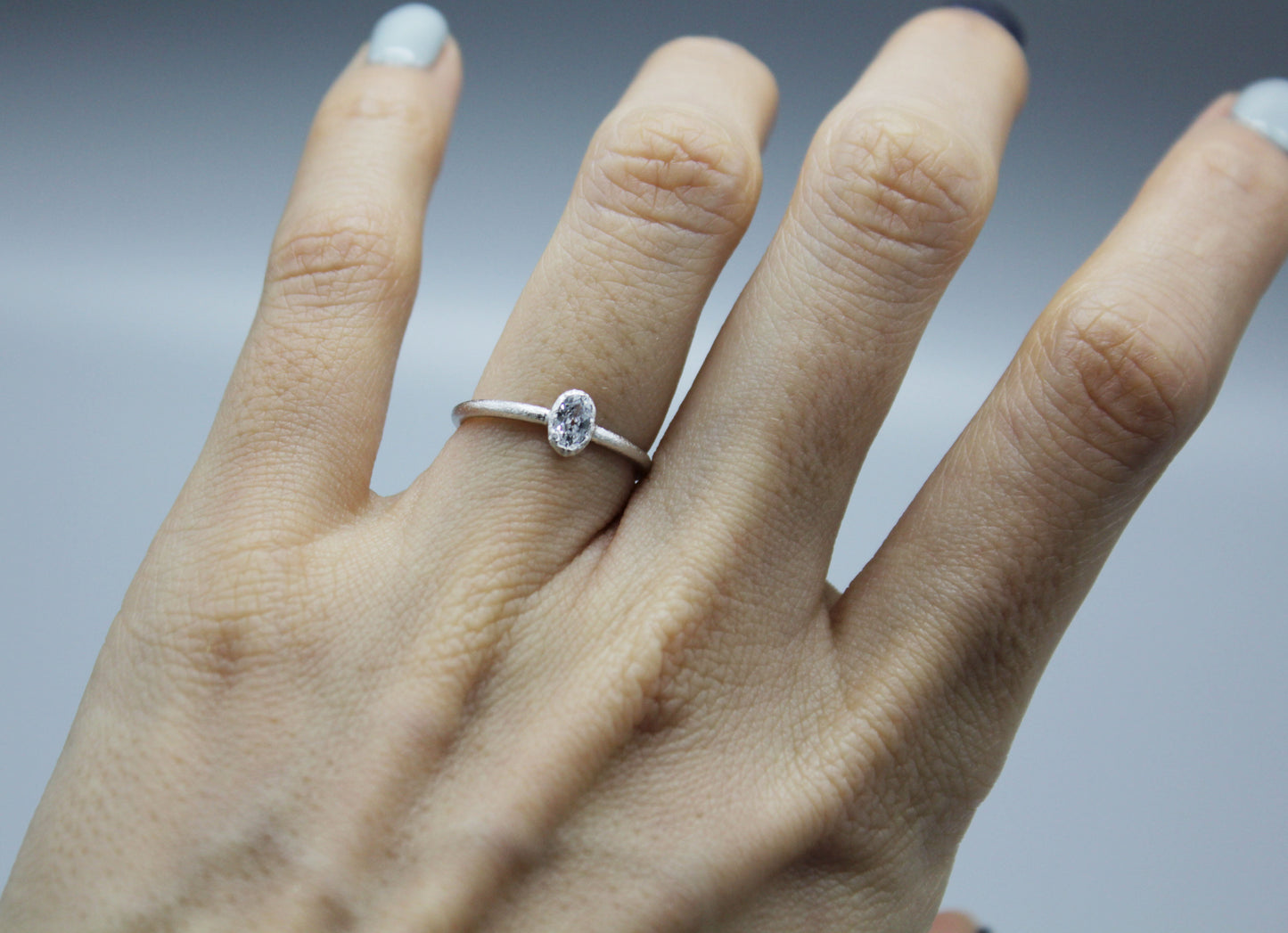 925 Sterling Silver Simple Stacking Ring detailed with Oval Cubic Zirconia, hammered ring