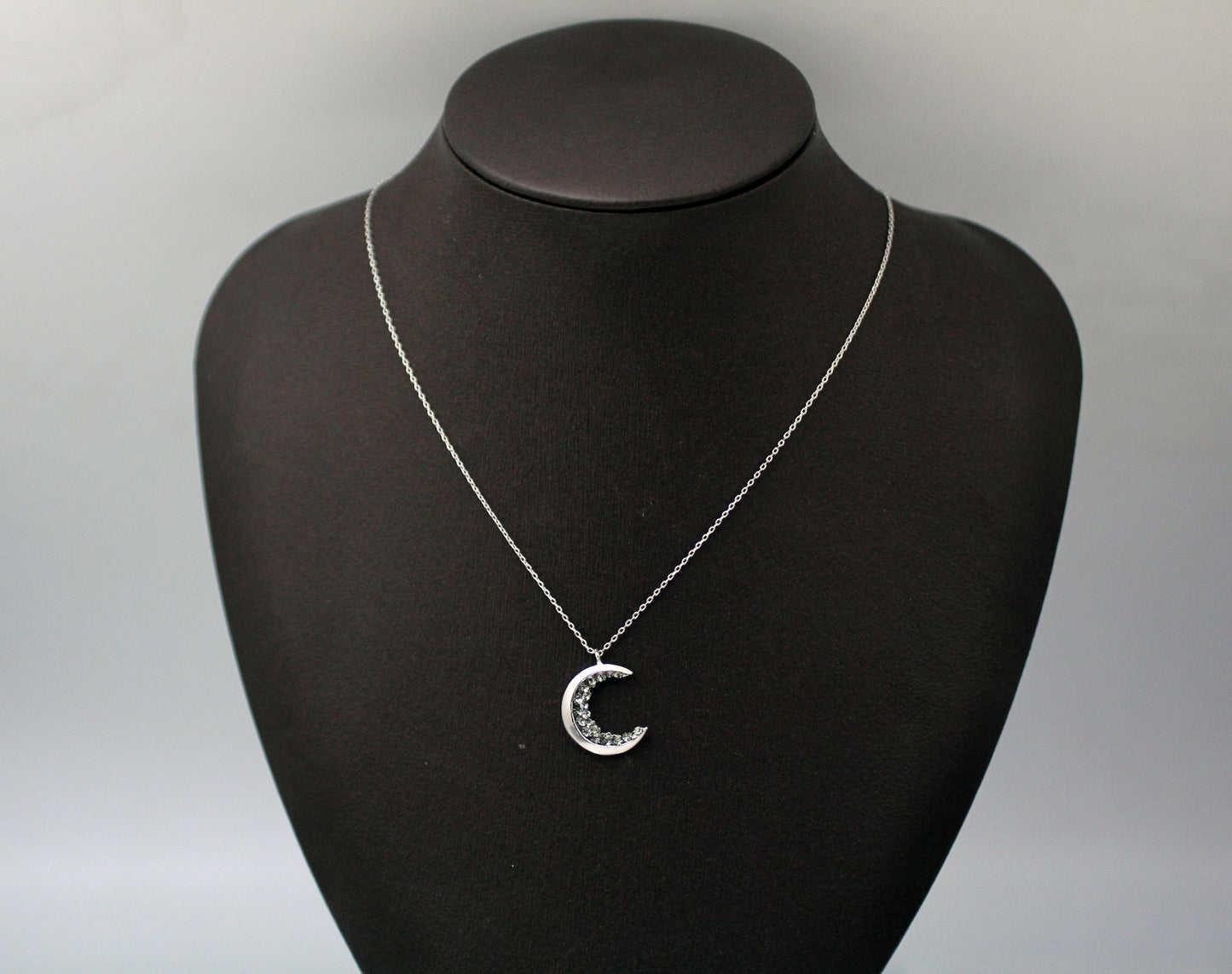 Crescent moon pendant Necklace detailed with Black Diamond Crystals