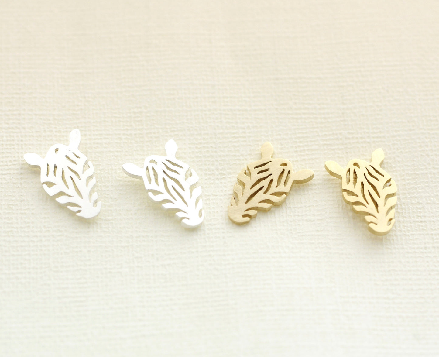 Cut-out Zebra Pendant Earrings in gold / silver