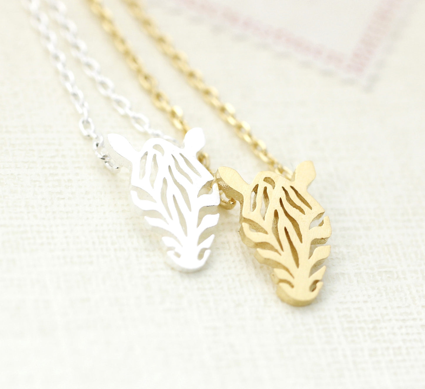 Cut-out Zebra Pendant Necklace in gold / silver